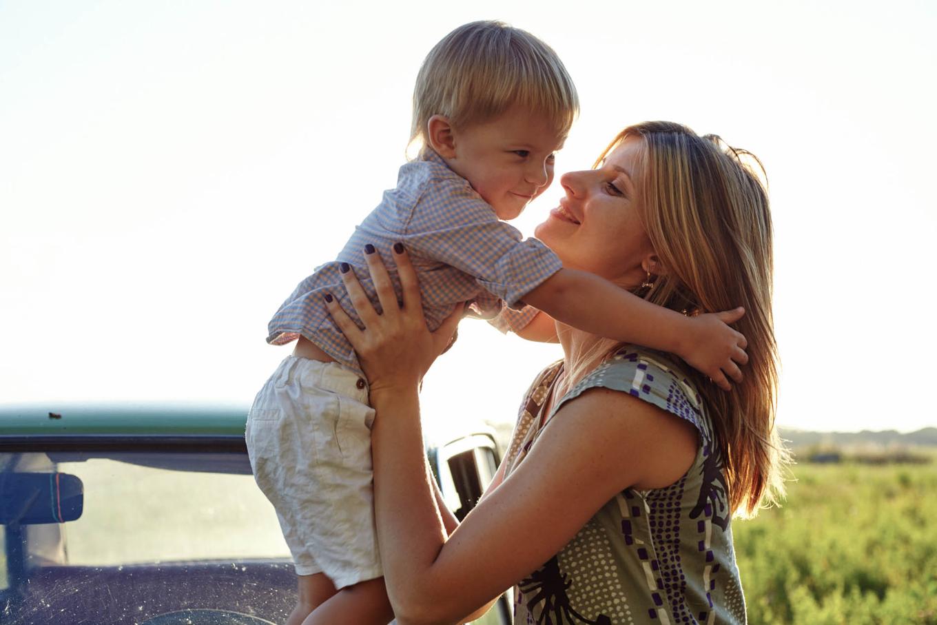 Mother and Child on Car Hood
